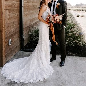 Beautiful detailed sheath dress with long train